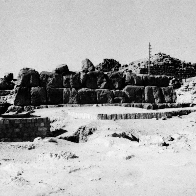 Plate I. a. Site of mastabas, looking southwest. Qar on right center, Idu to left. Mastaba of Kawab (G7110-7120) center rear. Subsidiary pyramid