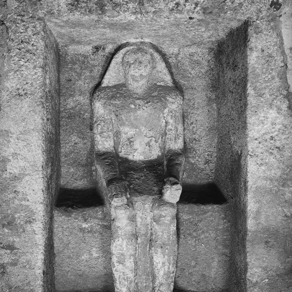 Plate IX. b. Qar, Court C, east wall, statue in niche